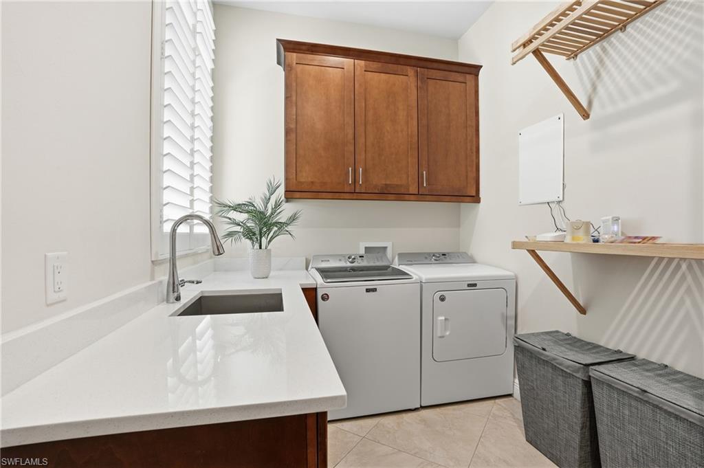 3707 5th Avenue Southwest Naples, FL 34117 - Photo 30 of 48 Doing laundry is a pleasure with amble countertop space, deep sink, and 42" upper cabinets