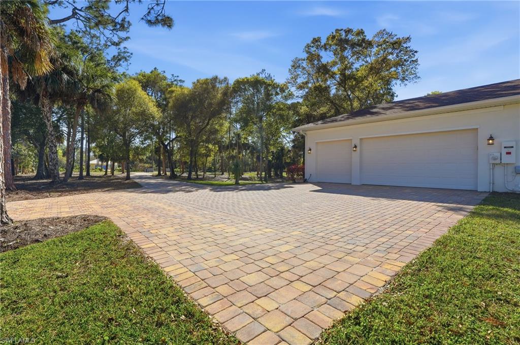 3707 5th Avenue Southwest Naples, FL 34117 - Photo 43 of 48 Wide paver driveway with extra parking area