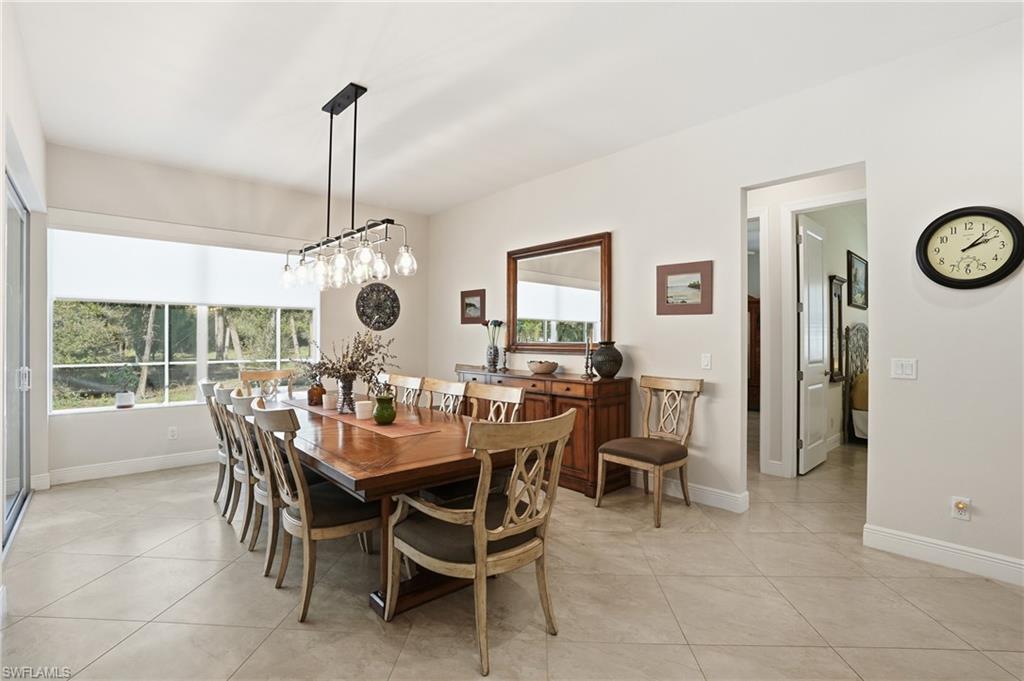 3707 5th Avenue Southwest Naples, FL 34117 - Photo 7 of 48 Dining room with baseboards and light tile patterned flooring