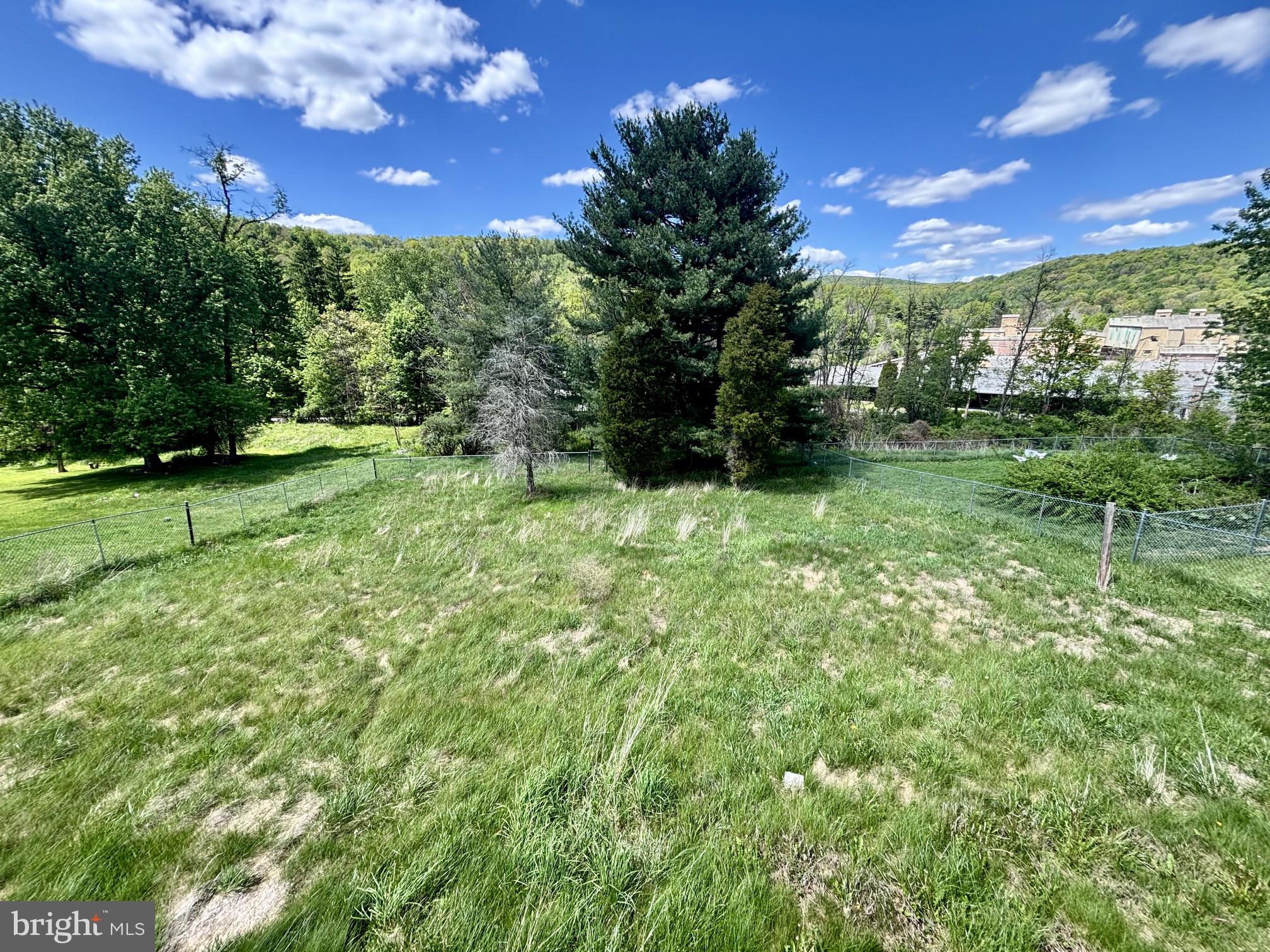 10631 New Hope Road Northwest Frostburg, MD 21532 - Photo 5 of 20 Serene green space under blue skies.