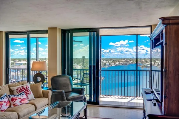 a view of a balcony with furniture