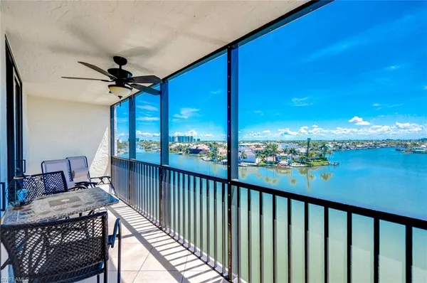 a view of balcony with furniture