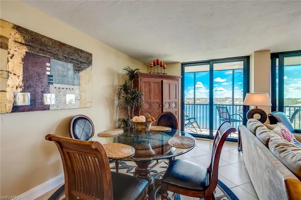 a dining room with furniture mountain view and a large window