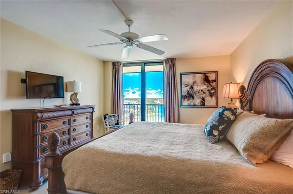 a view of a chair and tables in the balcony