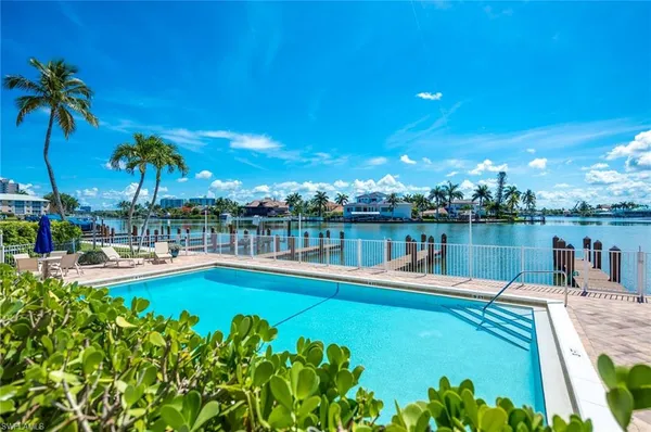 a view of a swimming pool with a lake view