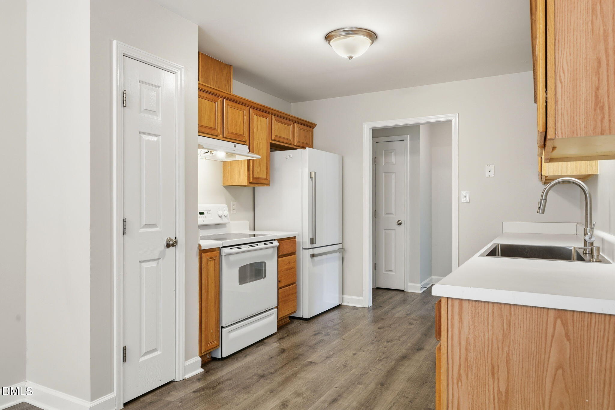 1005 Kavkaz Street Raleigh, NC 27610 - Photo 11 of 40 Kitchen with Pantry and LVP Floors