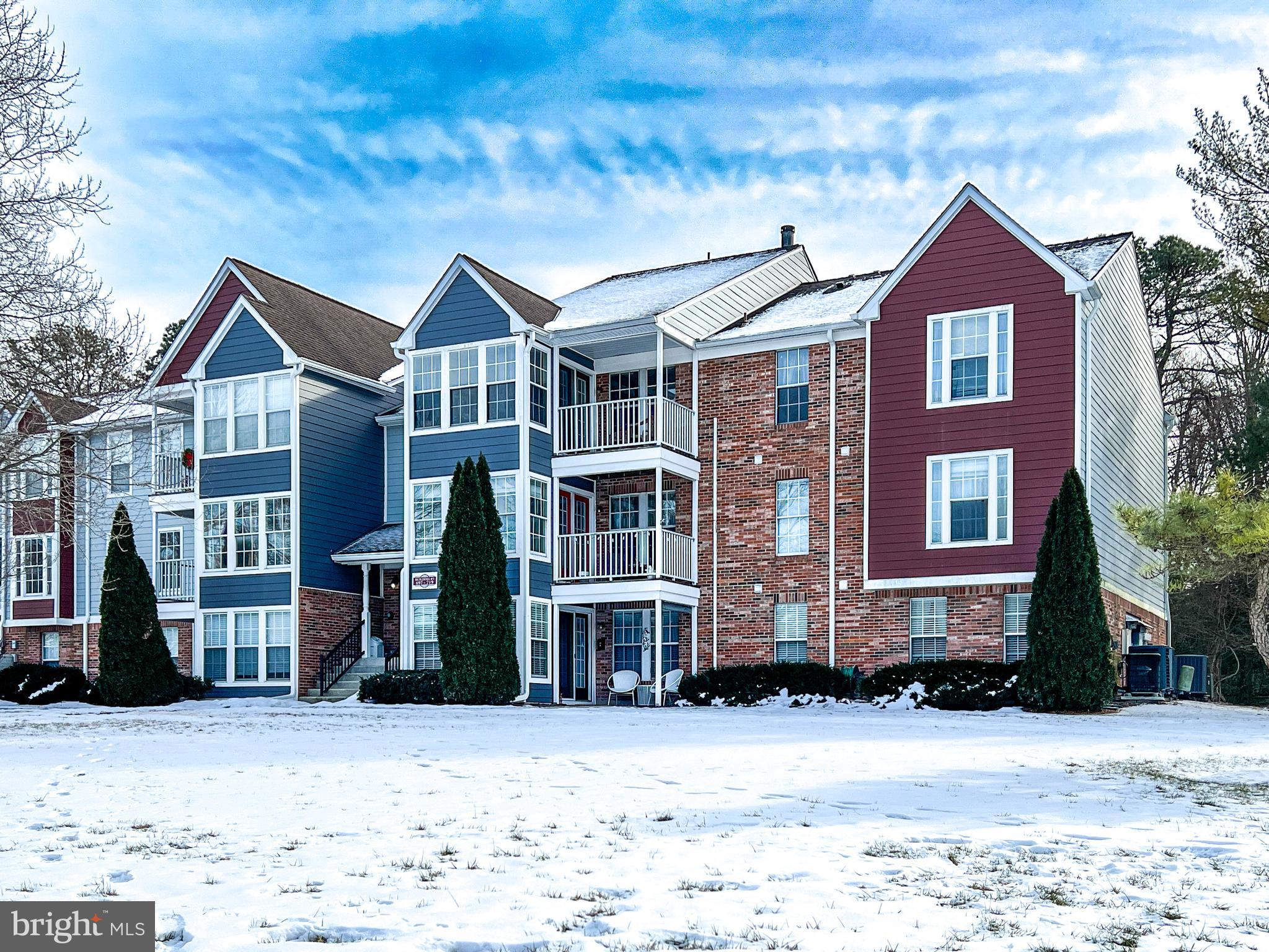 705 Deering Road, Unit 5E Pasadena, MD 21122 - Photo 1 of 19 a front view of a house with a yard