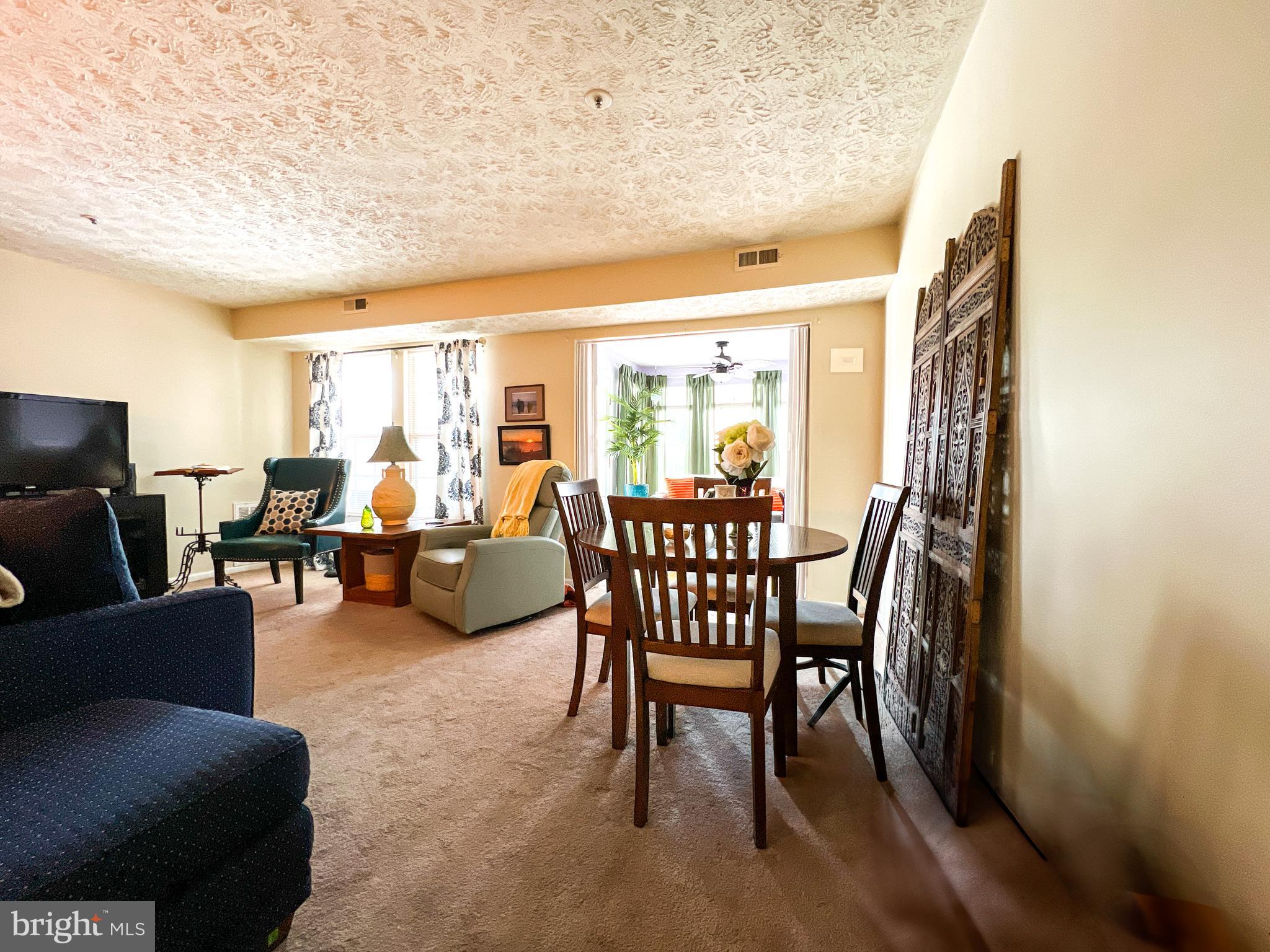 705 Deering Road, Unit 5E Pasadena, MD 21122 - Photo 8 of 19 a living room with furniture and a large window