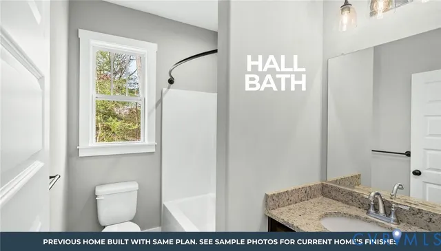 a bathroom with a sink a toilet and a window