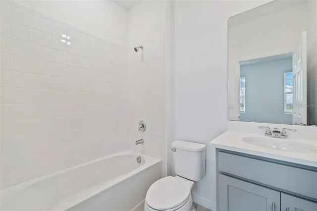 a bathroom with a sink toilet and bathtub