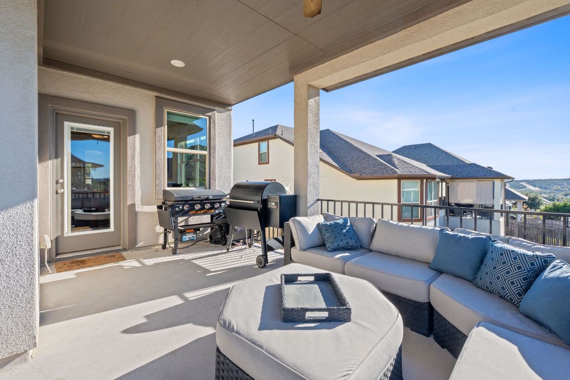 15604 Cabrillo Way Austin, TX 78738 - Photo 17 of 33 a living room with furniture and a large window