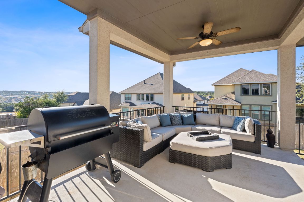15604 Cabrillo Way Austin, TX 78738 - Photo 18 of 33 a living room with patio furniture and a floor to ceiling window