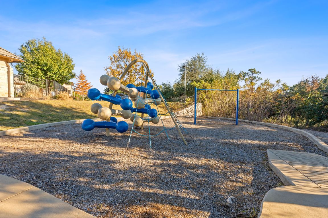 15604 Cabrillo Way Austin, TX 78738 - Photo 24 of 33 a backyard of a house with lots of green space
