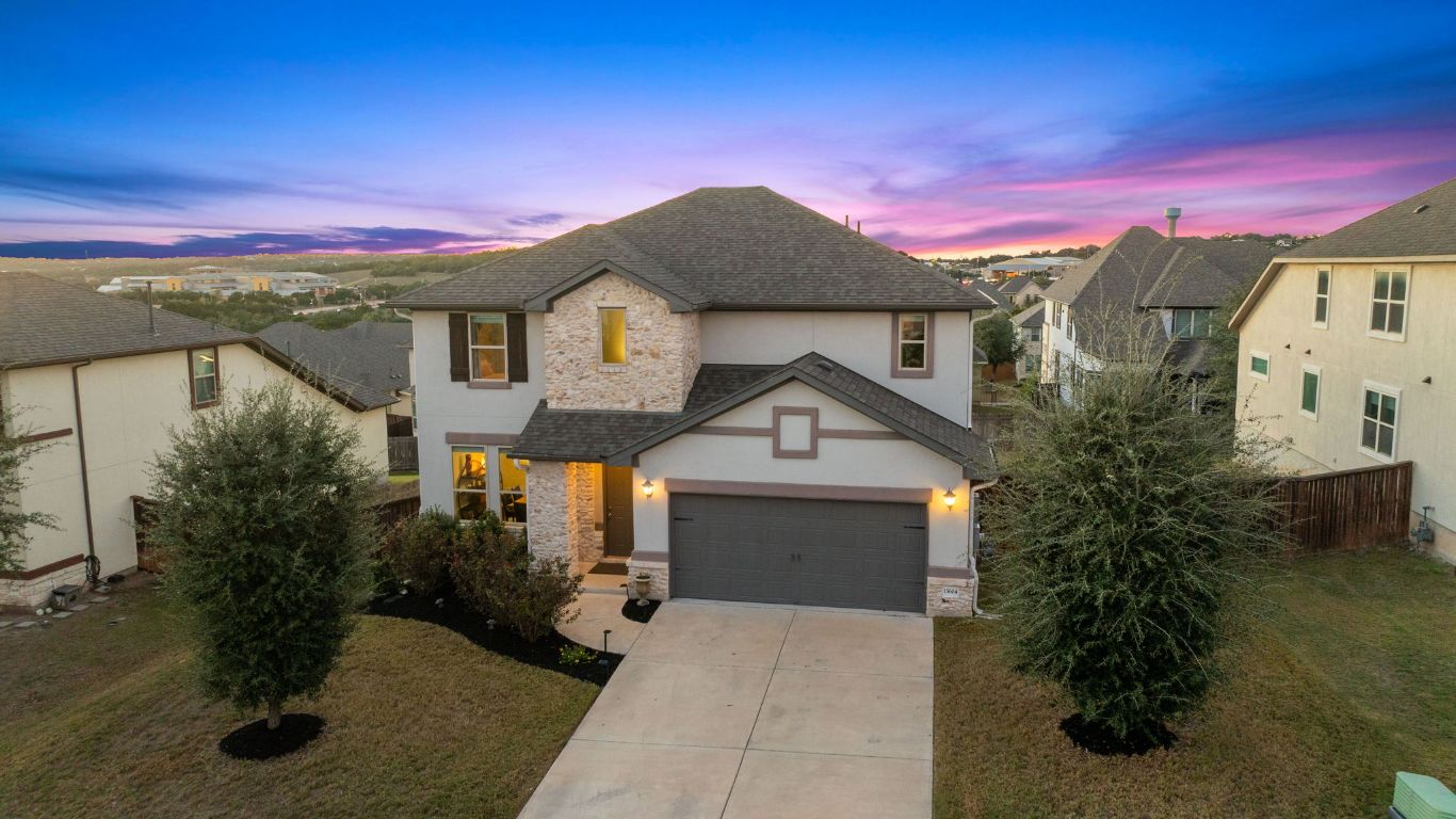 15604 Cabrillo Way Austin, TX 78738 - Photo 26 of 33 a front view of a house with a yard