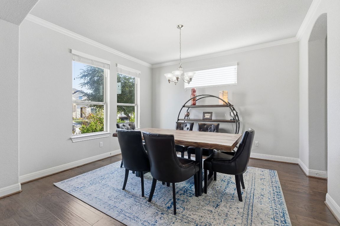 15604 Cabrillo Way Austin, TX 78738 - Photo 5 of 33 a view of a dining room with furniture window and wooden floor