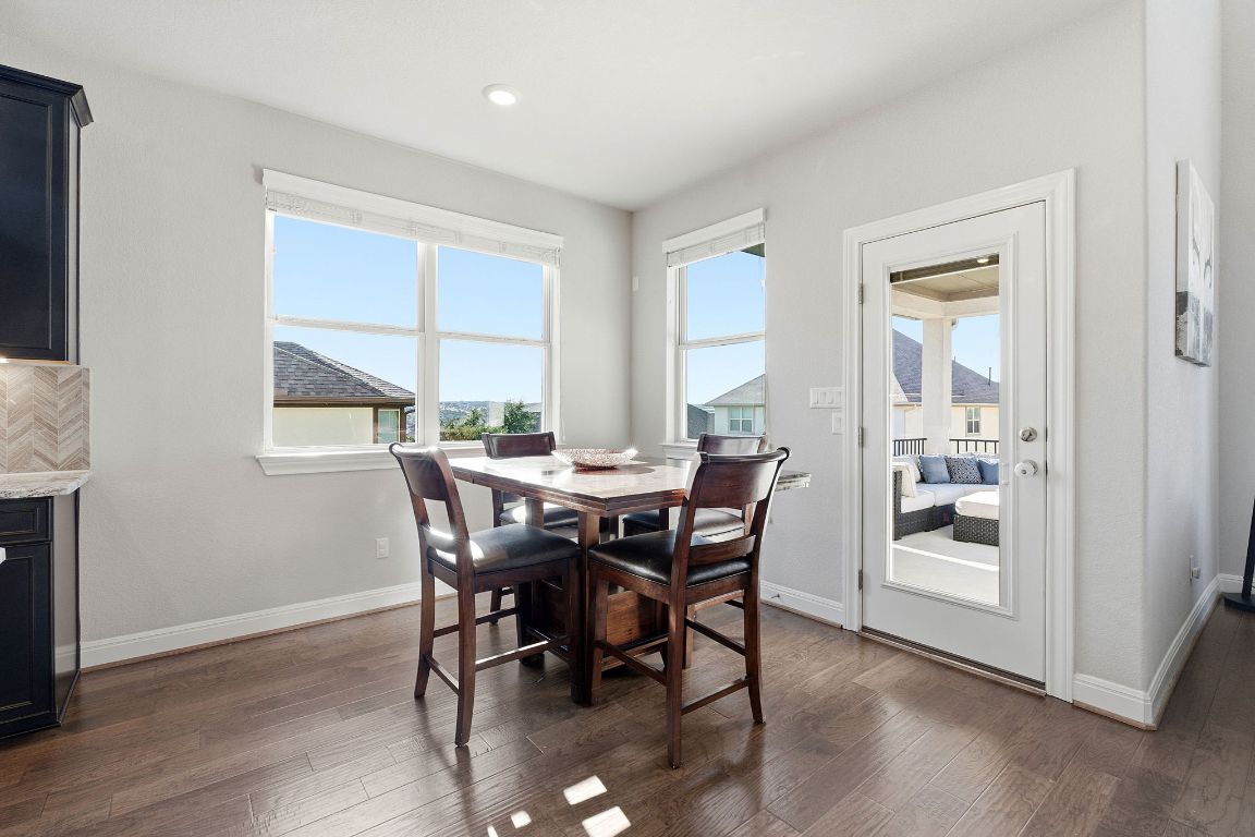 15604 Cabrillo Way Austin, TX 78738 - Photo 6 of 33 a view of a dining room with furniture window and wooden floor