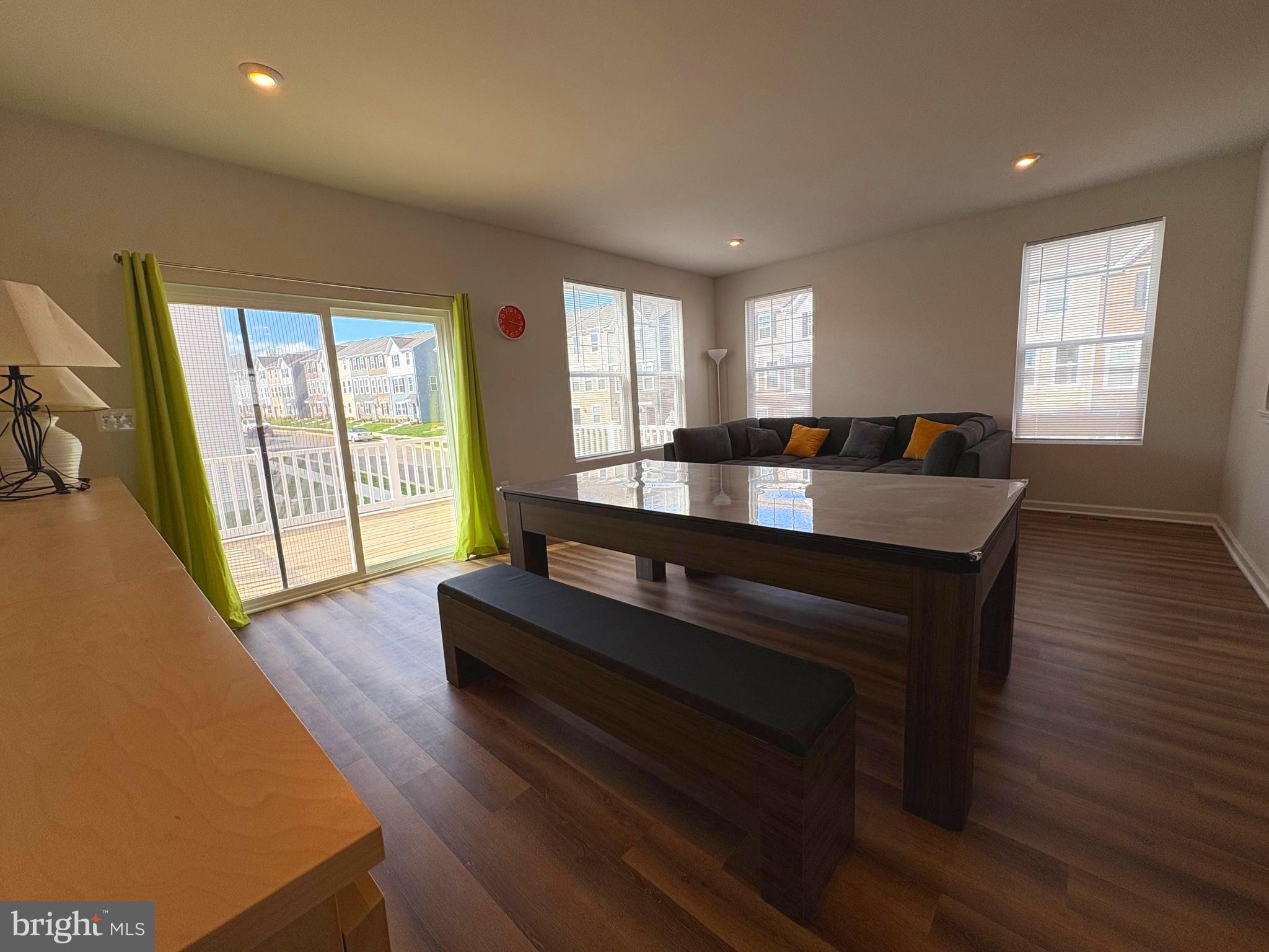 480 National Street Ranson, WV 25438 - Photo 11 of 24 a large living room with a large window wooden floor and furniture