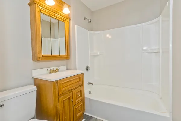 a bathroom with a sink a toilet and a bathtub