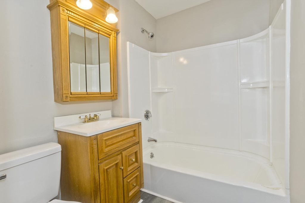 202 Oakland Street Springfield, MA 01108 - Photo 15 of 39 a bathroom with a sink a toilet and a bathtub