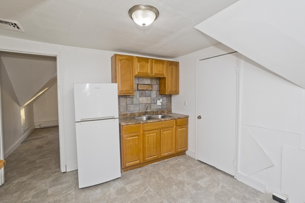 202 Oakland Street Springfield, MA 01108 - Photo 26 of 39 a room with storage and utility