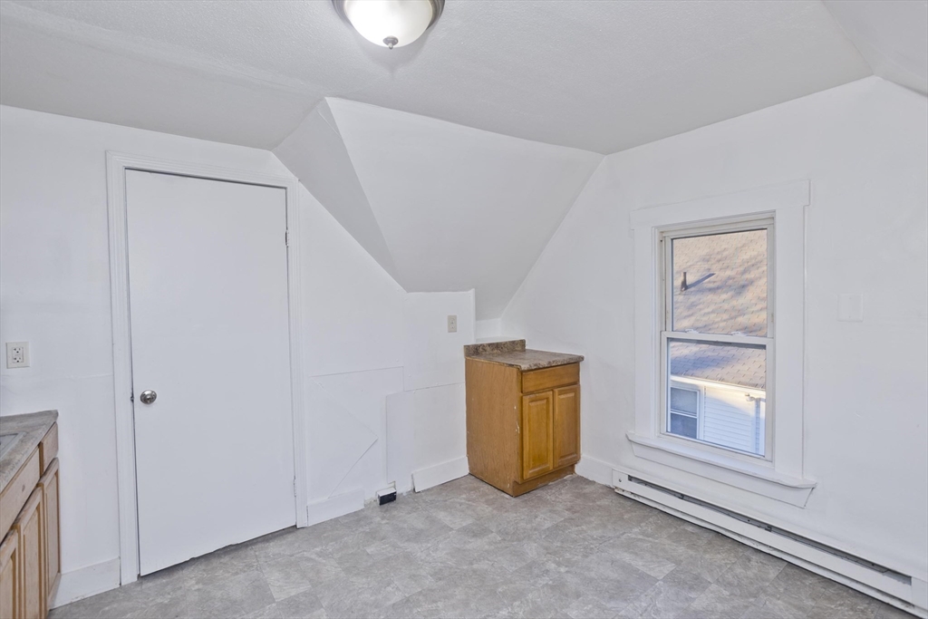 202 Oakland Street Springfield, MA 01108 - Photo 27 of 39 an empty room with windows and closet