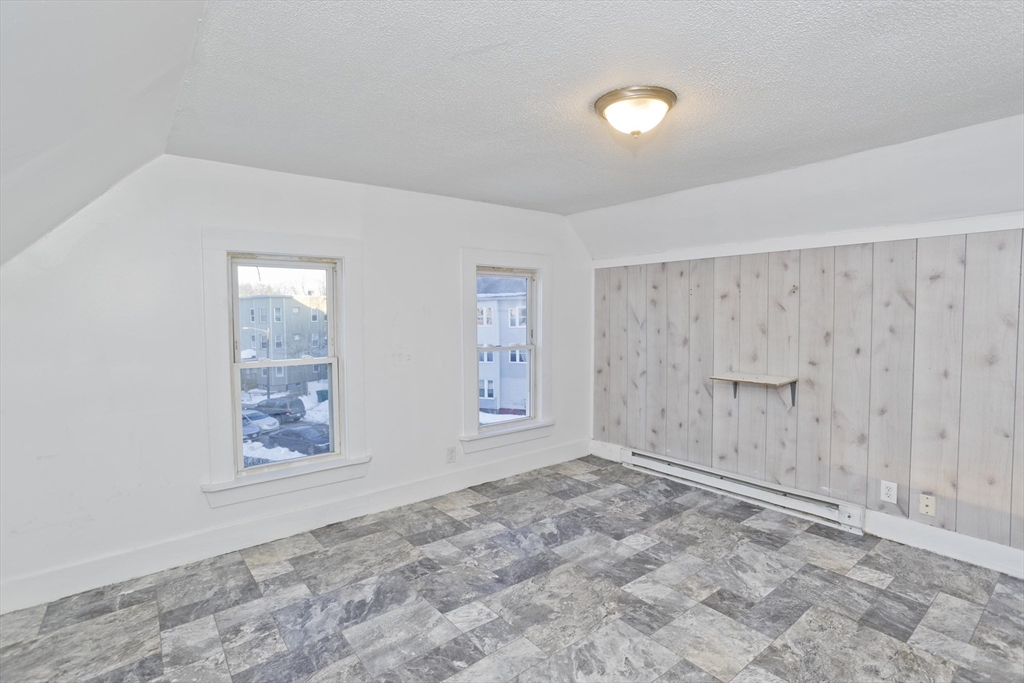 202 Oakland Street Springfield, MA 01108 - Photo 34 of 39 a view of an empty room with a window