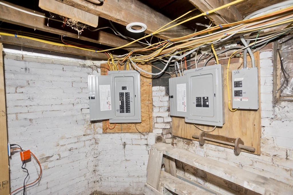 202 Oakland Street Springfield, MA 01108 - Photo 36 of 39 a bathroom with a granite countertop sink a mirror and shower