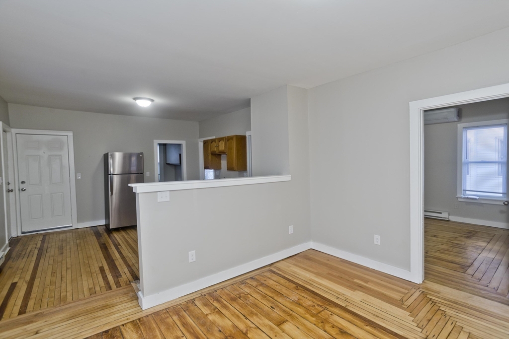 202 Oakland Street Springfield, MA 01108 - Photo 10 of 39 a view of a room with wooden floor and workspace