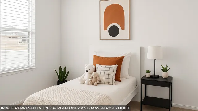 a bedroom with a bed and a potted plant