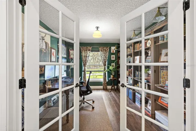 a view of a livingroom with furniture and staircase
