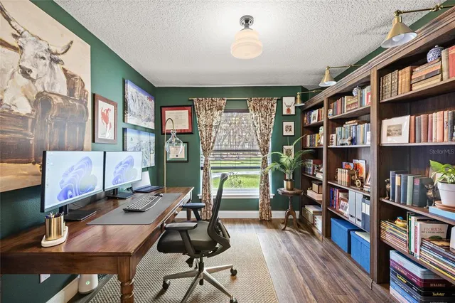 a workspace with furniture and a book shelf