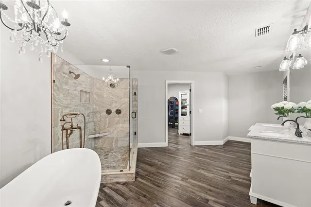 a bathroom with a sink toilet and shower