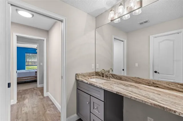a bathroom with a sink double vanity and a mirror
