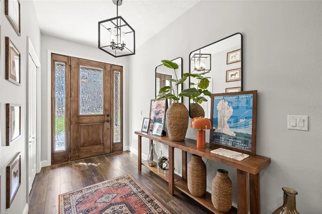 a view of an entryway with wooden floor