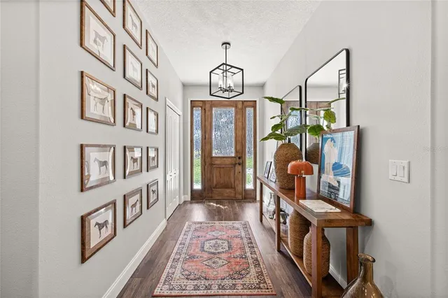 a view of an entryway with wooden floor