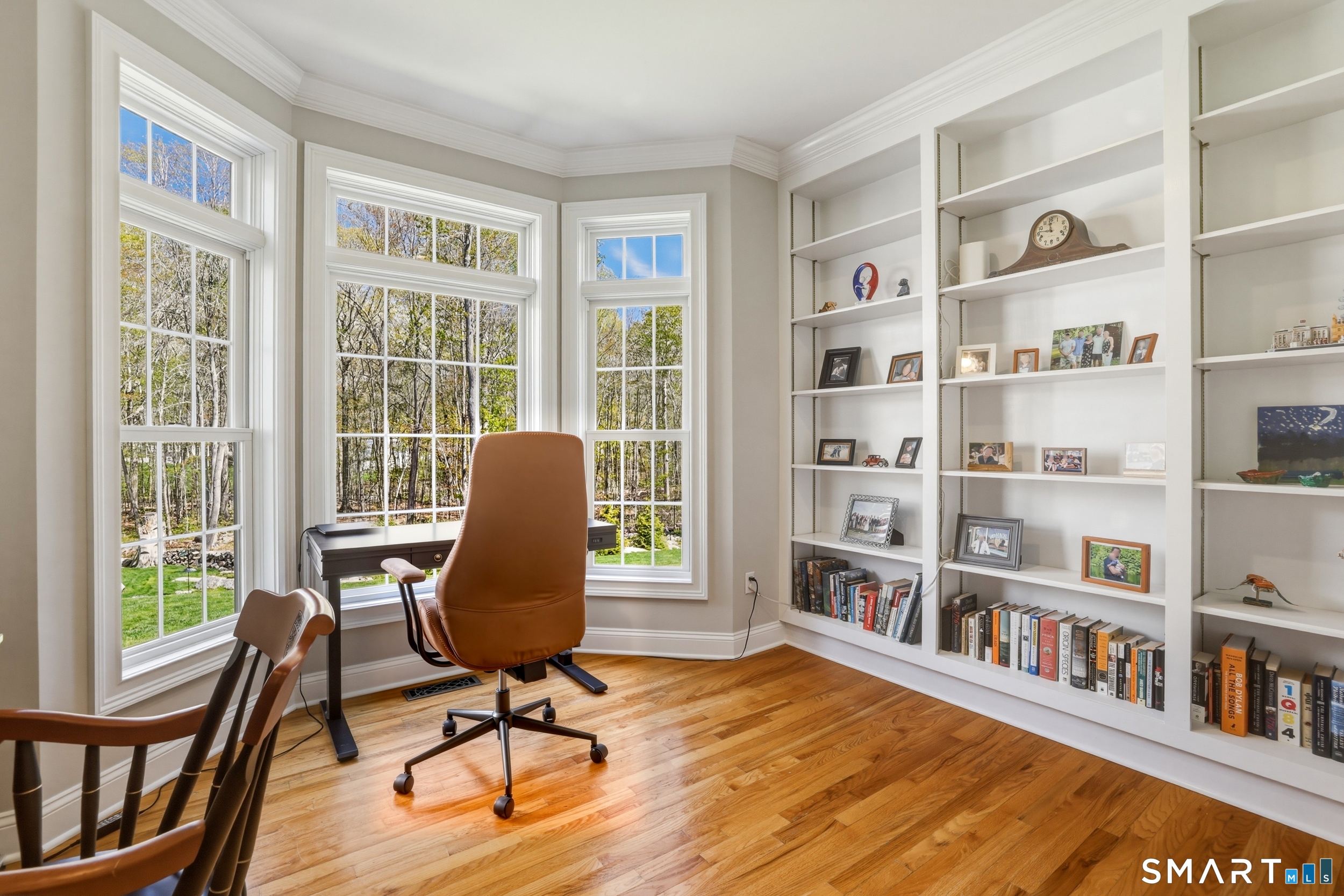 7 Timber Lane Guilford, CT 06437 - Photo 11 of 40 a view of a livingroom with furniture bookshelf and a window