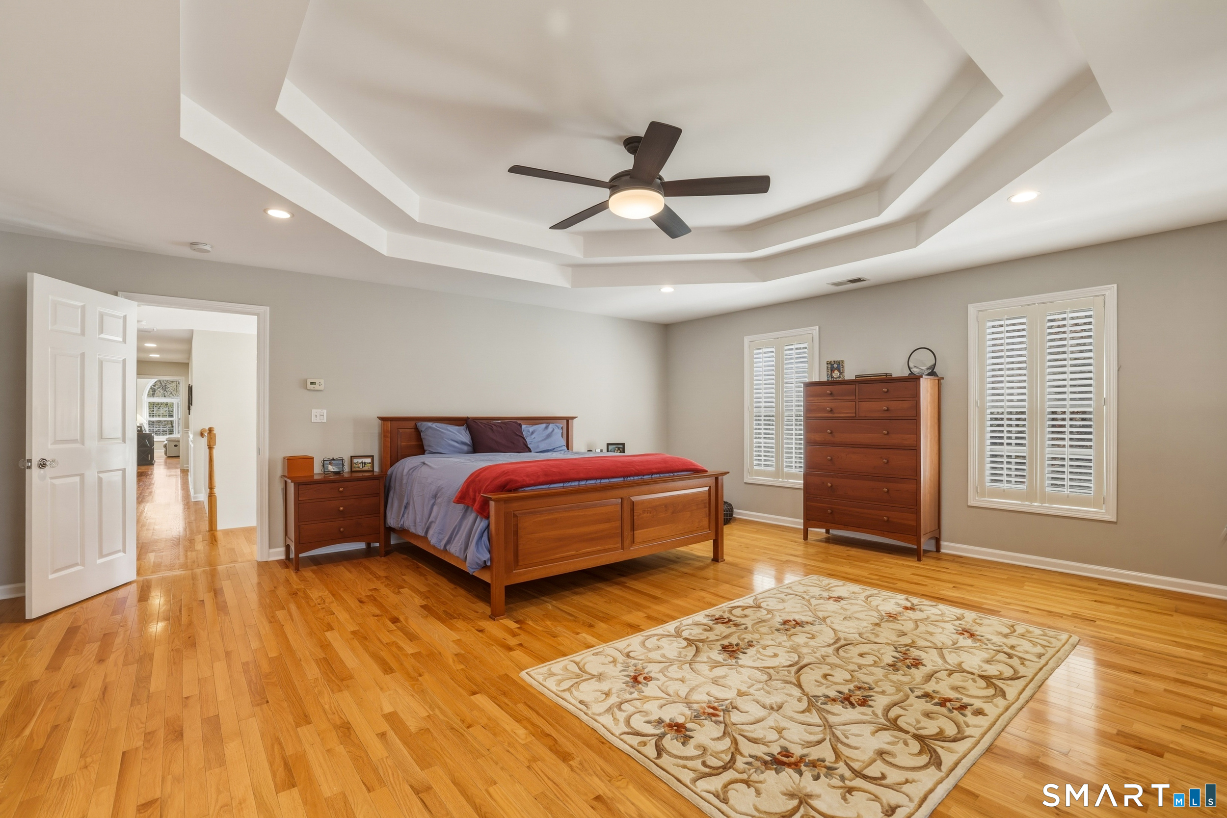 7 Timber Lane Guilford, CT 06437 - Photo 14 of 40 a spacious bedroom with a bed and wooden floor