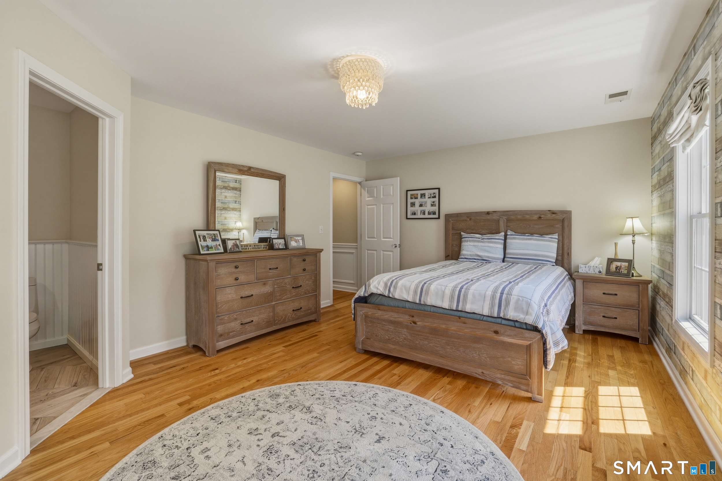 7 Timber Lane Guilford, CT 06437 - Photo 17 of 40 a bedroom with a bed and a lamp on dresser