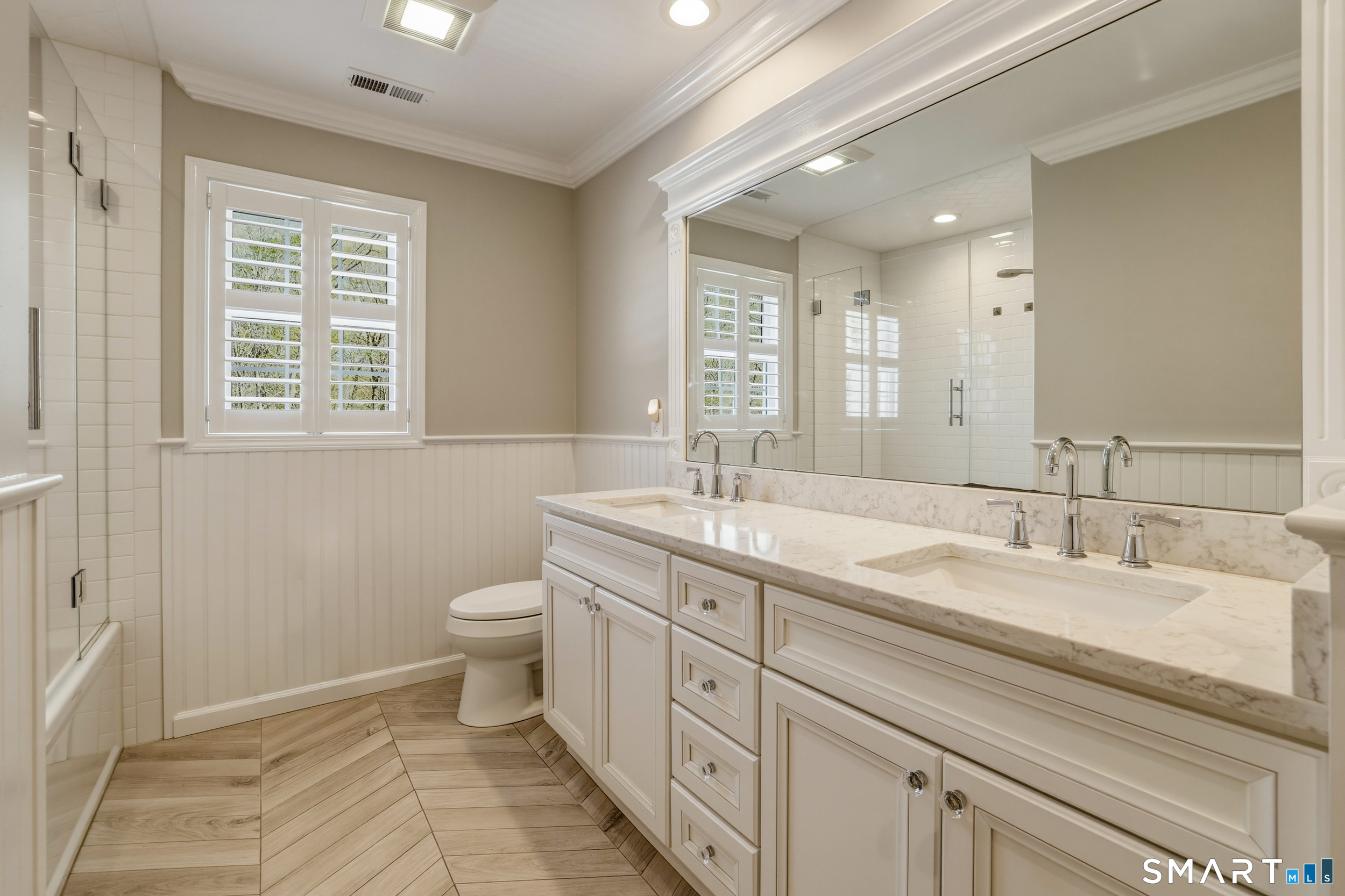 7 Timber Lane Guilford, CT 06437 - Photo 21 of 40 a spacious bathroom with a double vanity sink a mirror and a toilet