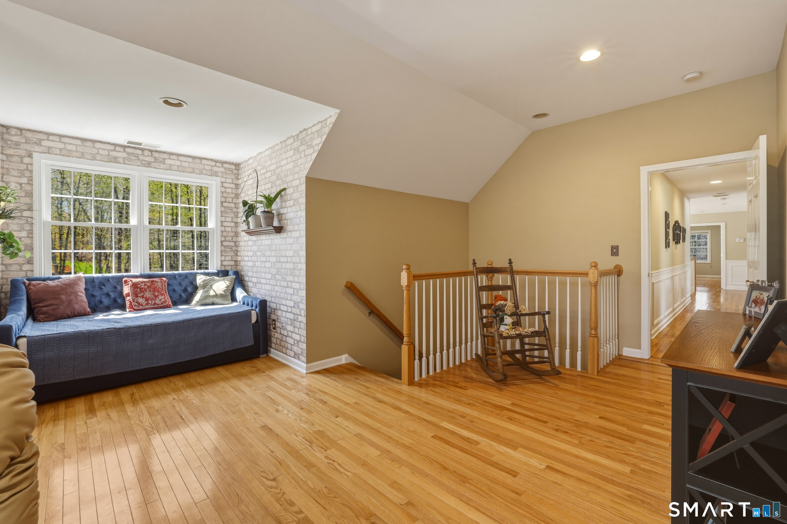 7 Timber Lane Guilford, CT 06437 - Photo 22 of 40 a living room with furniture and a wooden floor