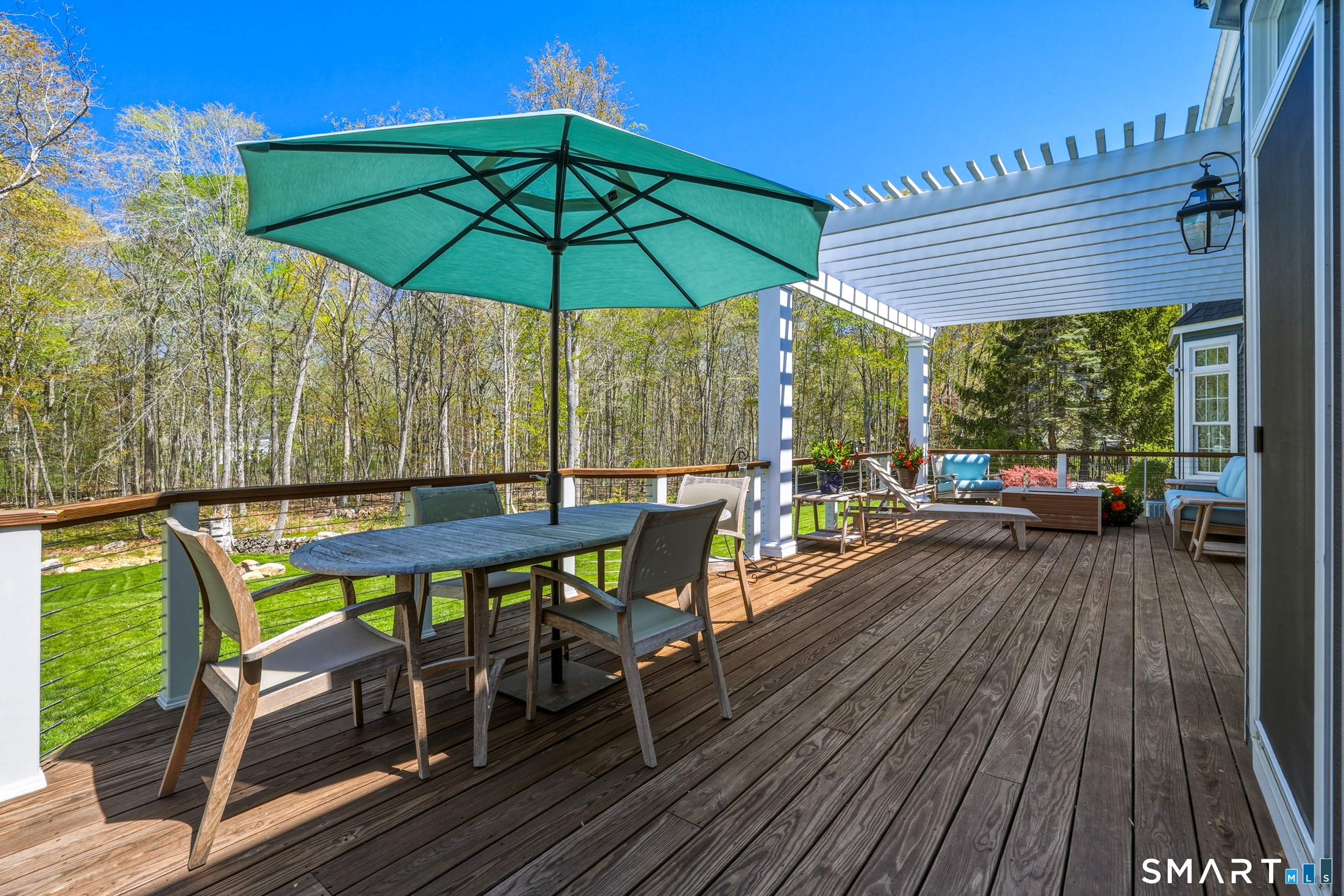 7 Timber Lane Guilford, CT 06437 - Photo 28 of 40 a view of balcony with chairs and wooden floor