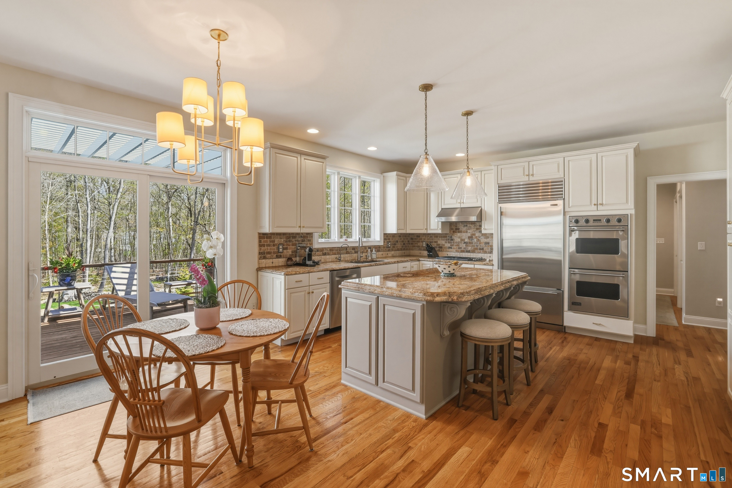 7 Timber Lane Guilford, CT 06437 - Photo 6 of 40 an open kitchen with a table and chairs