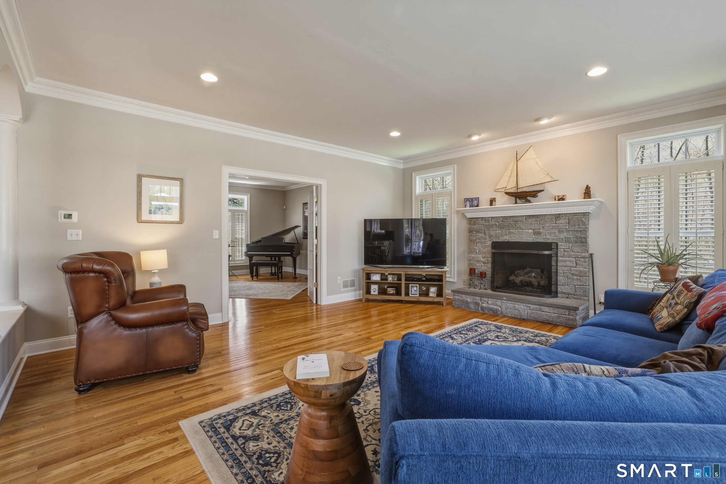 7 Timber Lane Guilford, CT 06437 - Photo 8 of 40 a living room with furniture or couch and a fireplace