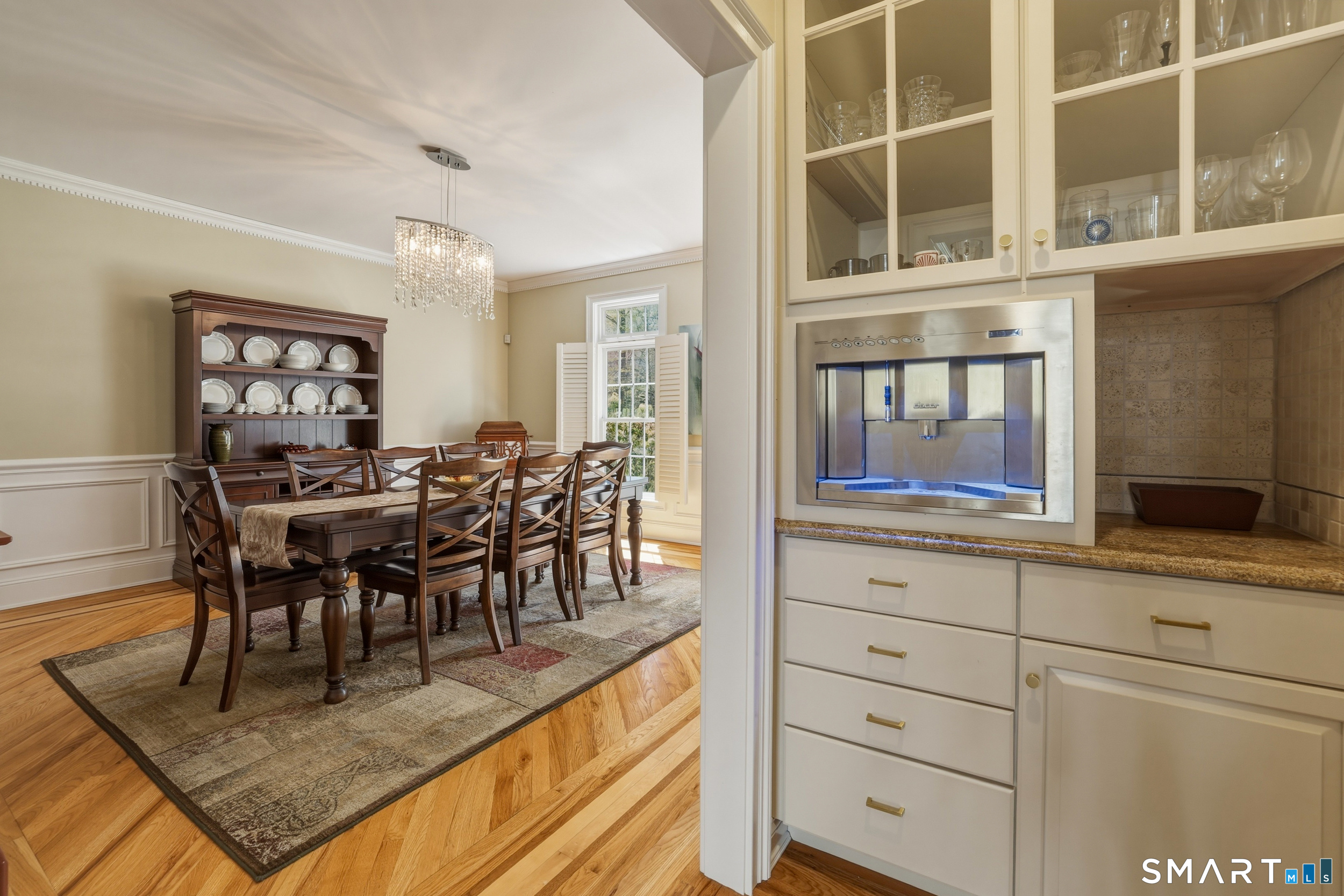 7 Timber Lane Guilford, CT 06437 - Photo 10 of 40 a view of a dining room with furniture and chandelier
