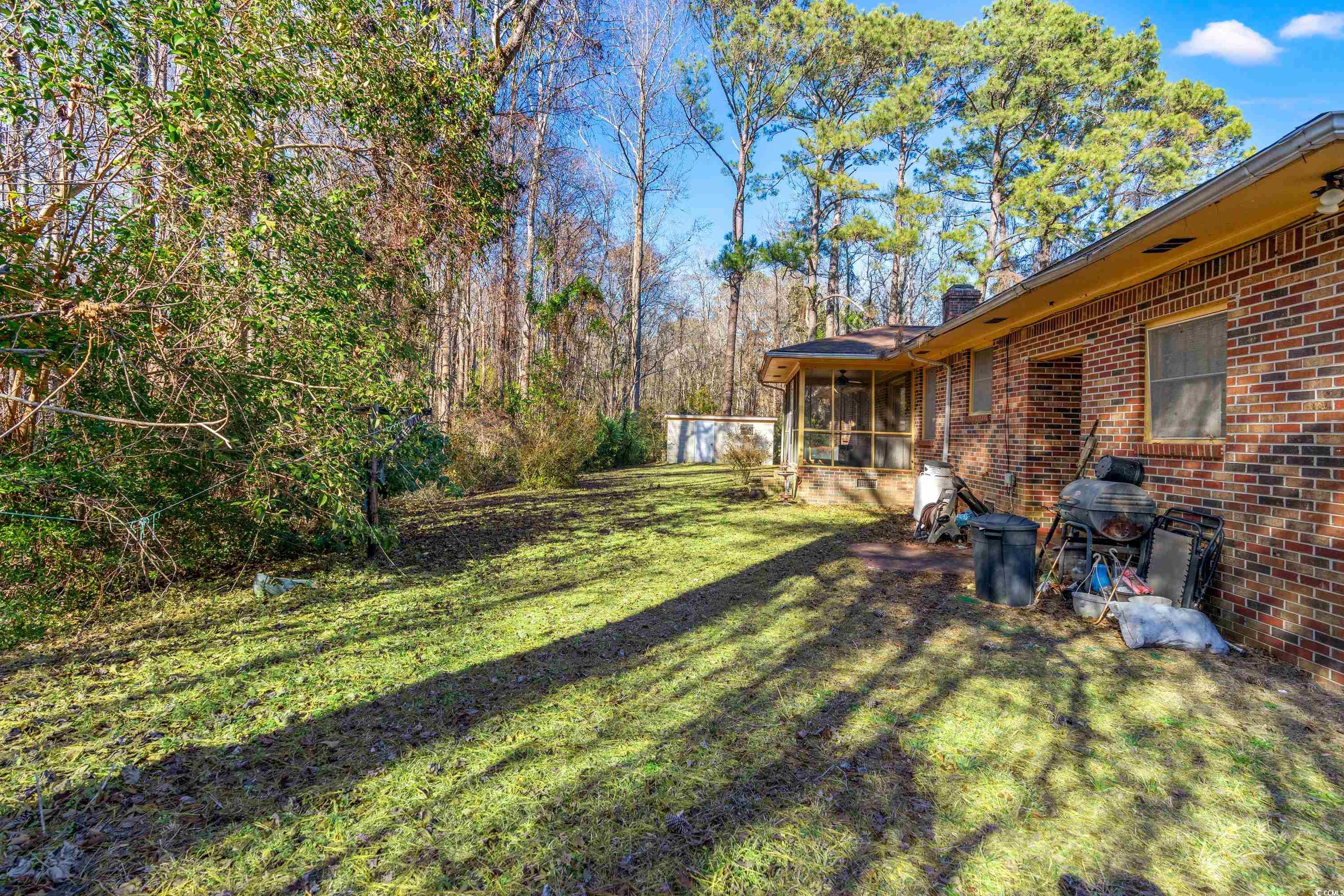 3592 South Island Road Georgetown, SC 29440 - Photo 15 of 24 View of yard with a sunroom