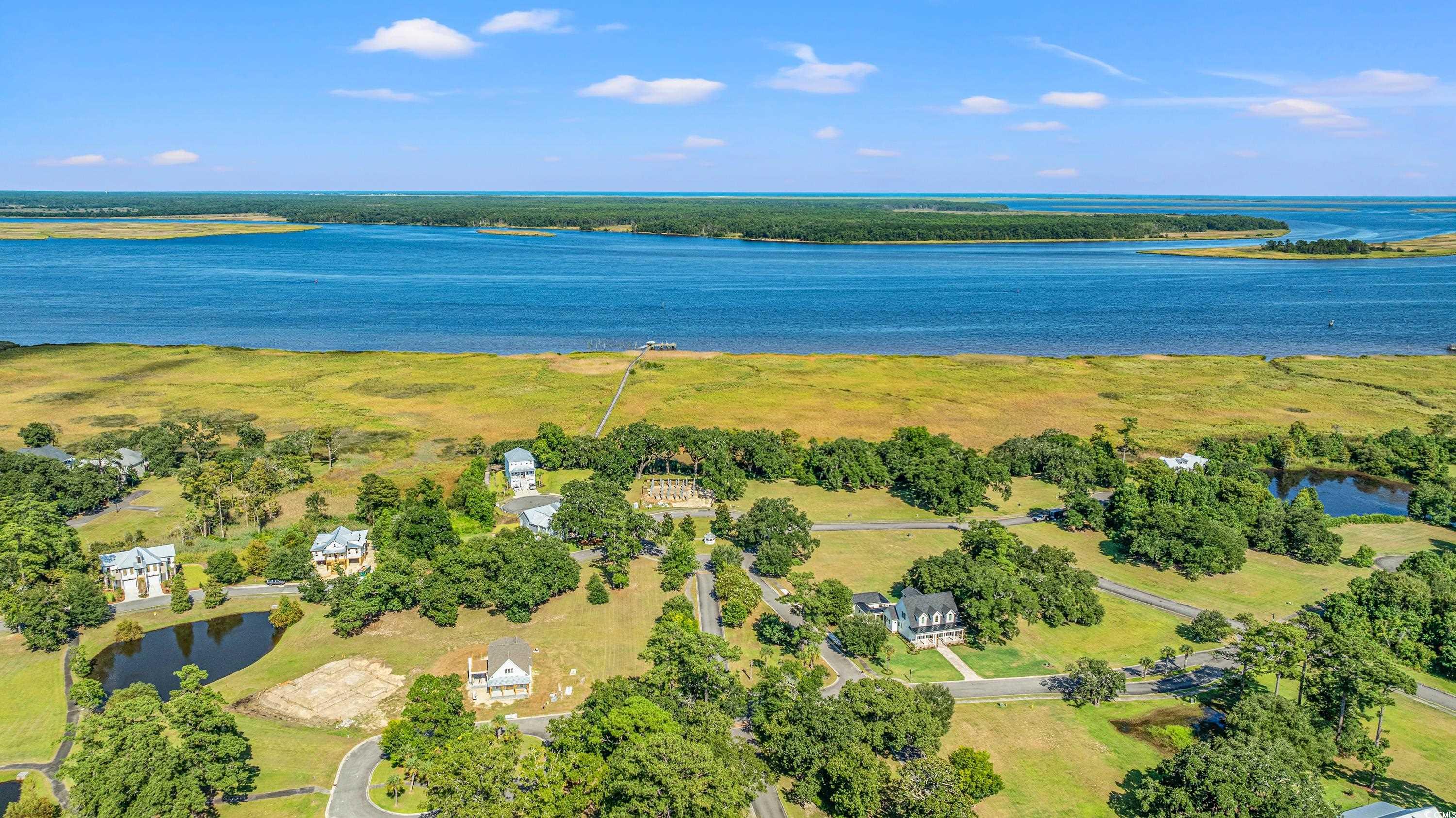 3592 South Island Road Georgetown, SC 29440 - Photo 21 of 24 Birds eye view of property featuring a water view