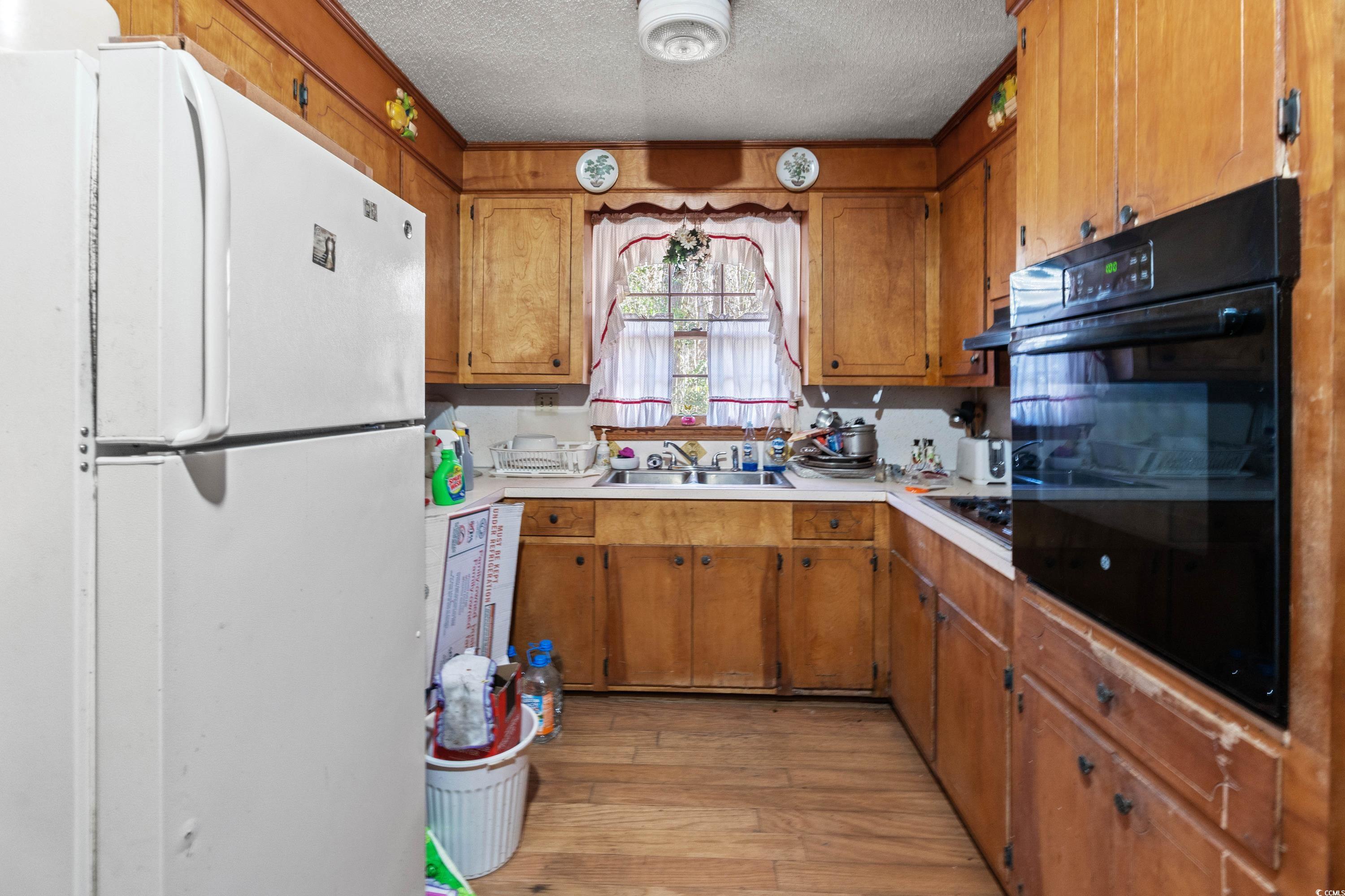 3592 South Island Road Georgetown, SC 29440 - Photo 2 of 24 Kitchen with a textured ceiling, light countertops