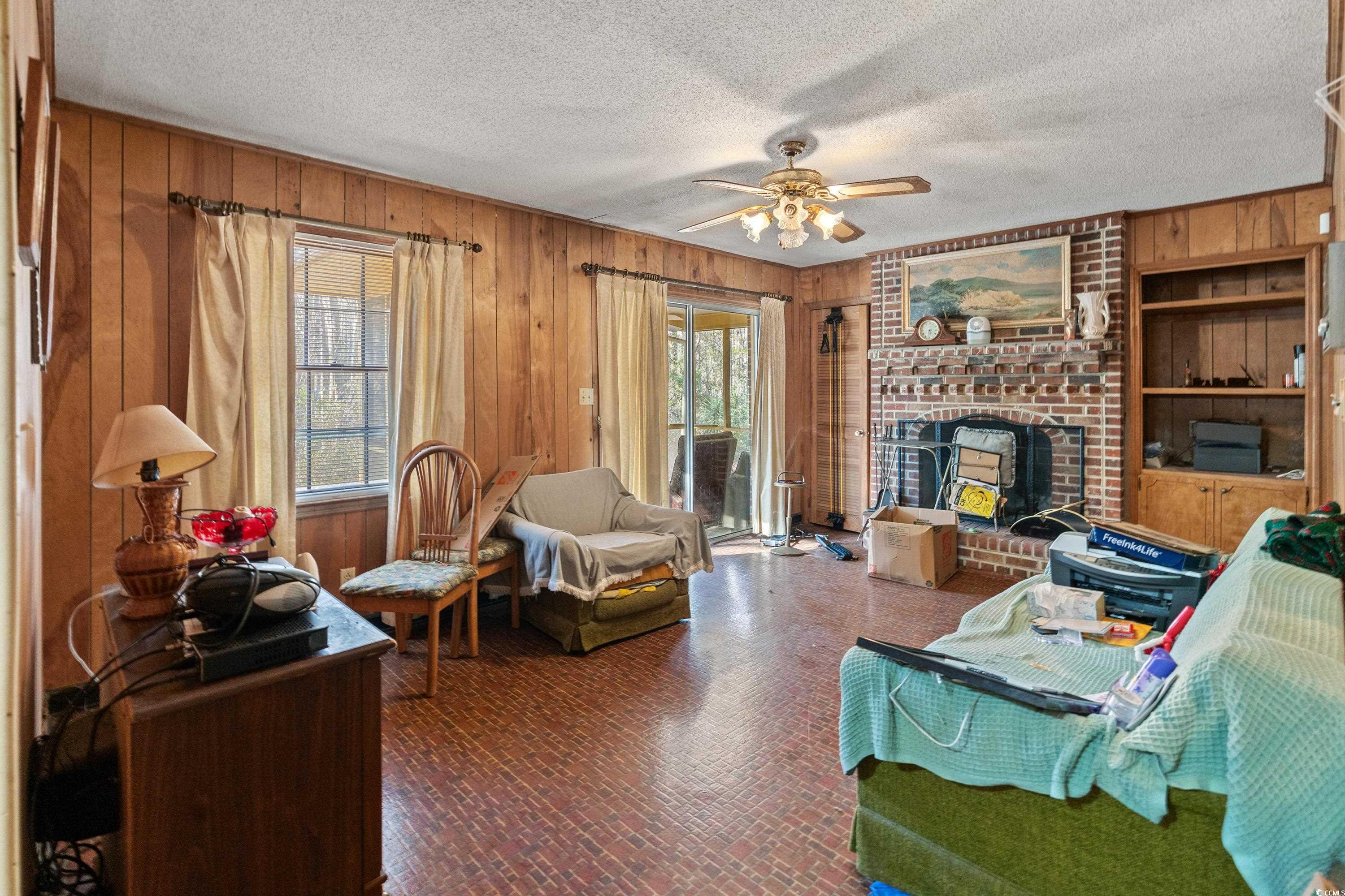 3592 South Island Road Georgetown, SC 29440 - Photo 3 of 24 Living area with plenty of natural light, wood wal