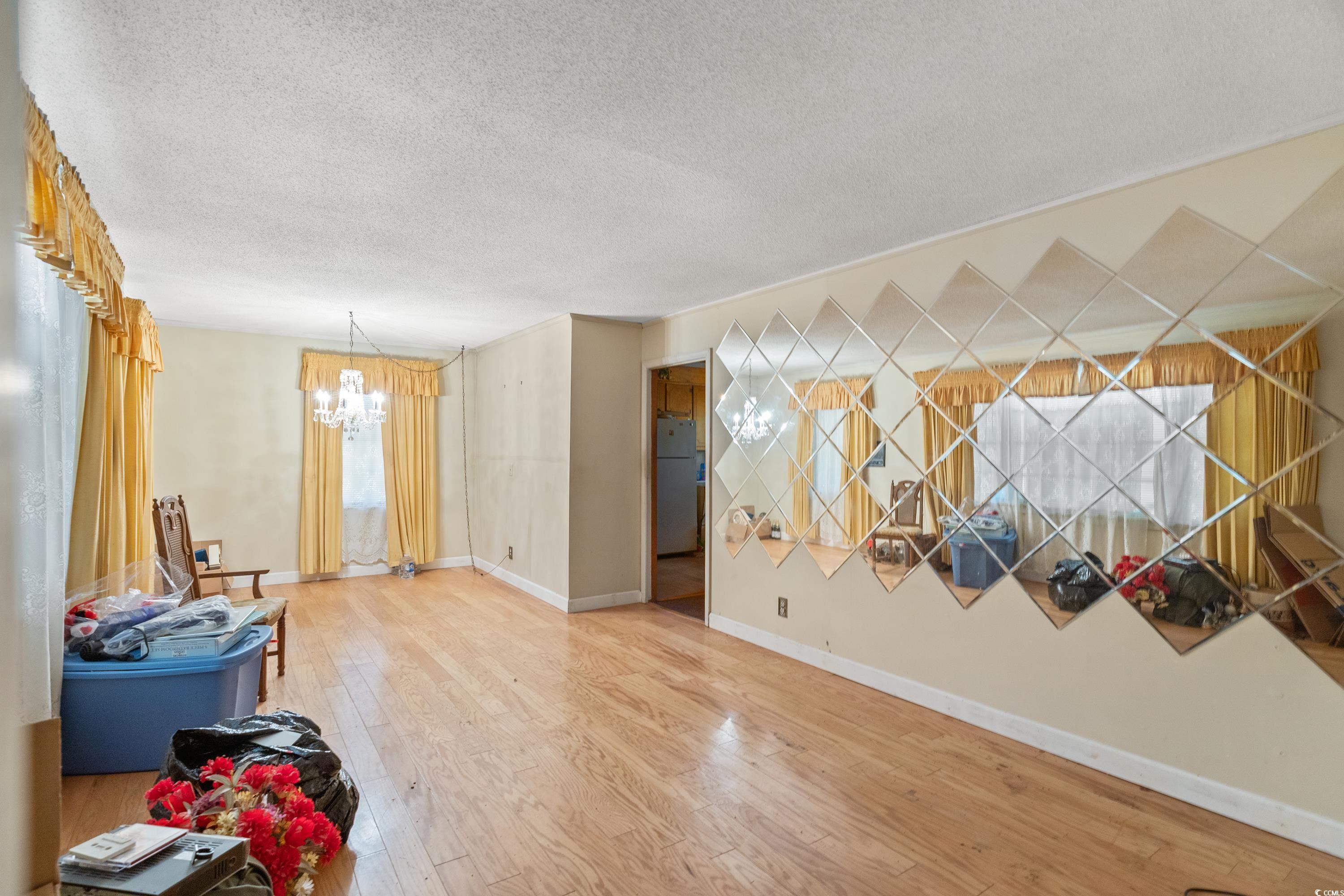 3592 South Island Road Georgetown, SC 29440 - Photo 5 of 24 Interior space featuring baseboards, a textured ce