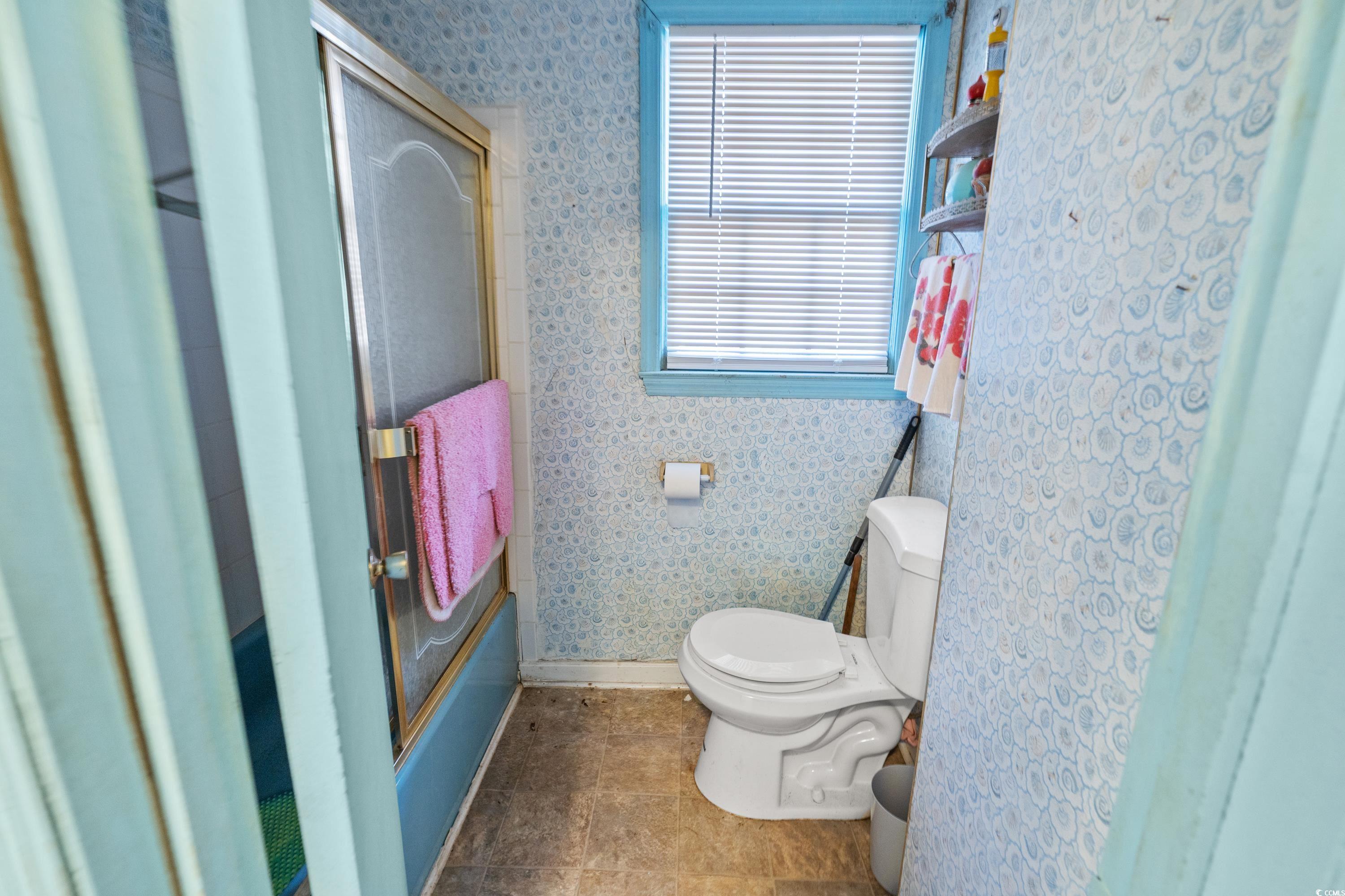 3592 South Island Road Georgetown, SC 29440 - Photo 8 of 24 Bathroom with baseboards, a shower with shower doo